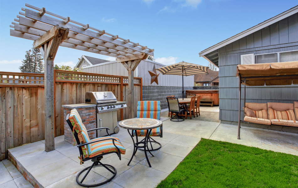 Bistro-style outdoor dining patio with grill