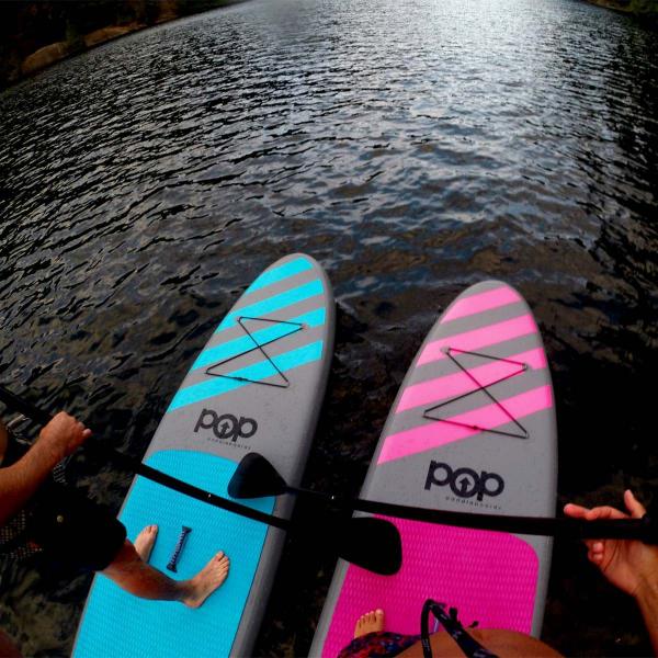 Blue and Pink Paddleboards Side by Side